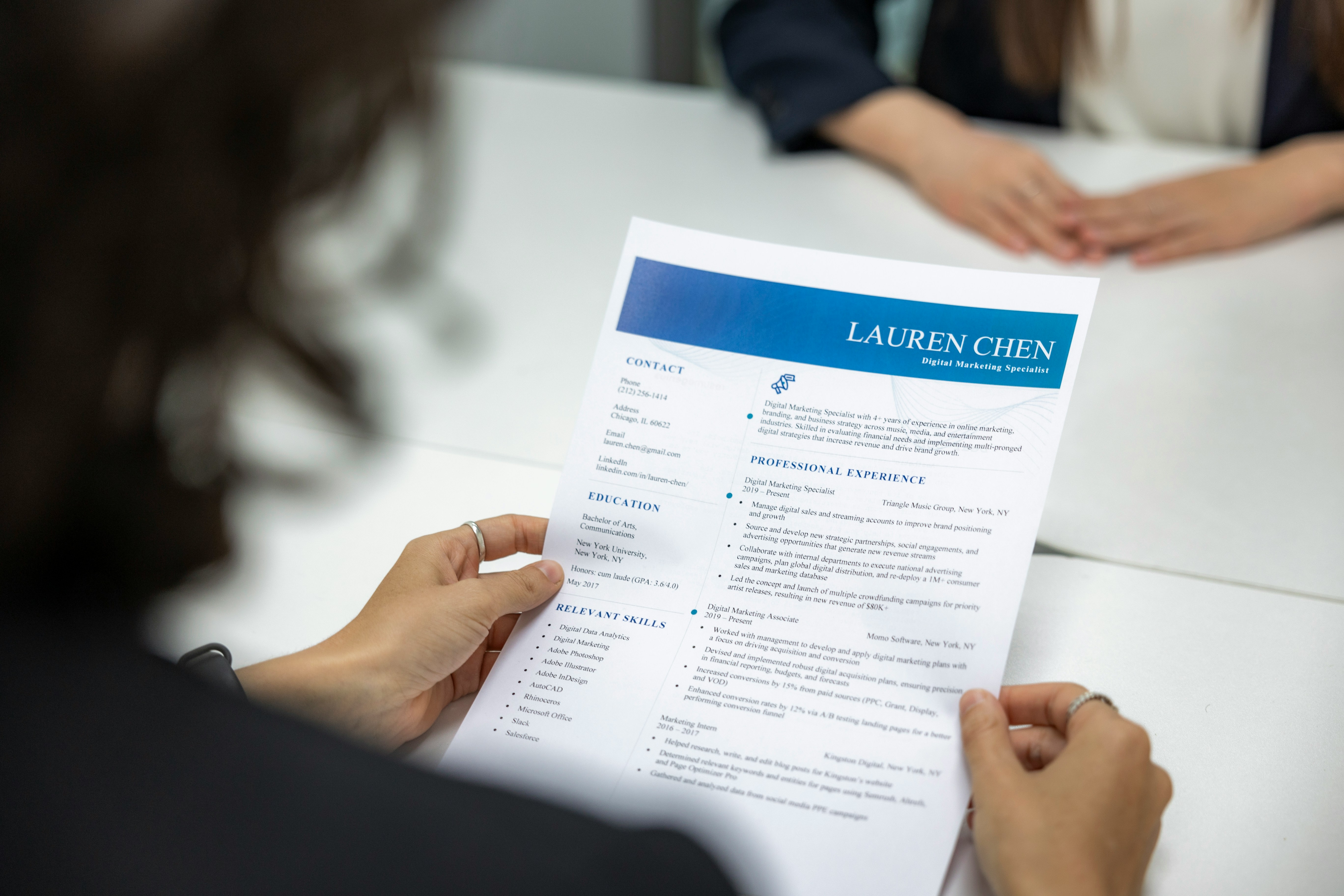 Recruiter reviewing resumes
